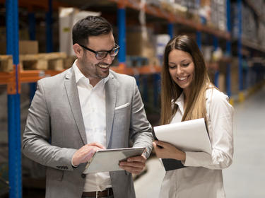 A woman and man in a warehouse